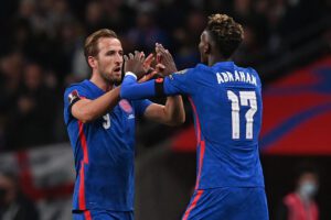 England's striker Harry Kane (L) comes off for England's striker Tammy Abraham (R) during the FIFA World Cup 2022 Group I qualifier football match between England and Albania at Wembley Stadium in London on November 12, 2021. - - NOT FOR MARKETING OR ADVERTISING USE / RESTRICTED TO EDITORIAL USE (Photo by Glyn KIRK / AFP) / NOT FOR MARKETING OR ADVERTISING USE / RESTRICTED TO EDITORIAL USE (Photo by GLYN KIRK/AFP via Getty Images)