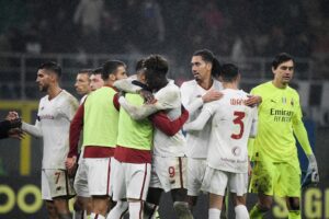AS Roma's British forward Tammy Abraham (C) celebrates with teammates at the end of the Italian Serie A football match between AC Milan and AS Roma, at the San Siro stadium in Milan, on January 8, 2023. (Photo by Filippo MONTEFORTE / AFP) (Photo by FILIPPO MONTEFORTE/AFP via Getty Images)
