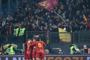 AS Romas players celebrate after AS Romas Argentinian forward Paulo Dybala scored a goal during the Italian Serie A football match between AS Roma and Fiorentina on January 15, 2023 at the Olympic stadium in Rome. (Photo by Vincenzo PINTO / AFP) (Photo by VINCENZO PINTO/AFP via Getty Images)
