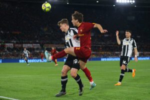 ROME, ITALY - APRIL 16: Edoardo Bove of AS Roma is challenged by Jaka Bijol of Udinese Calcio during the Serie A match between AS Roma and Udinese Calcio at Stadio Olimpico on April 16, 2023 in Rome, Italy. (Photo by Paolo Bruno/Getty Images)