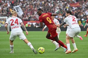 AS Roma's British forward Tammy Abraham (C) fights for the ball with AC Milan's Danish defender Simon Kjaer (L) during the Italian Serie A football match between AS Rome and AC Milan at the Olympic stadium in Rome on April 29, 2023. (Photo by Alberto PIZZOLI / AFP) (Photo by ALBERTO PIZZOLI/AFP via Getty Images)