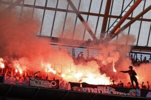 PSV Eindhoven supporters set off flares during the Dutch Eredivisie football match between Feyenoord and PSV at Feyenoord Stadium de Kuip in Rotterdam on May 8, 2022. - - Netherlands OUT (Photo by MAURICE VAN STEEN / ANP / AFP) / Netherlands OUT (Photo by MAURICE VAN STEEN/ANP/AFP via Getty Images)