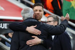 LEVERKUSEN, GERMANY - MAY 18: Jose Mourinho, Head Coach of AS Roma, embraces Xabi Alonso, Head Coach of Bayer 04 Leverkusen, prior to the UEFA Europa League semi-final second leg match between Bayer 04 Leverkusen and AS Roma at BayArena on May 18, 2023 in Leverkusen, Germany. (Photo by Lars Baron/Getty Images)