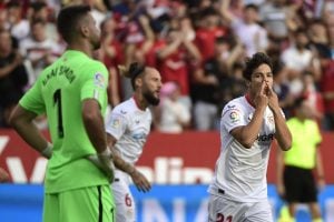 Sevilla's Spanish midfielder Oliver Torres (R) celebrates scoring the opening goal during the Spanish League football match between Sevilla FC and Athletic Club Bilbao at the Ramon Sanchez Pizjuan stadium in Seville on October 8, 2022. (Photo by CRISTINA QUICLER / AFP) (Photo by CRISTINA QUICLER/AFP via Getty Images)