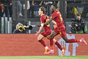 AS Roma's Italian midfielder Edoardo Bove (L) celebrates with AS Roma's British forward Tammy Abraham (R) after scoring the opening goal during the UEFA Europa League semi-final first leg football match between AS Roma and Bayer Leverkusen at the Olympic Stadium in Rome on May 11, 2023. (Photo by Alberto PIZZOLI / AFP) (Photo by ALBERTO PIZZOLI/AFP via Getty Images)
