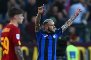 Inter Milan's Italian defender Federico Dimarco celebrates after opening the scoring during the Italian Serie A football match between AS Rome and Inter Milan on May 6, 2023 at the Olympic stadium in Rome. (Photo by Vincenzo PINTO / AFP) (Photo by VINCENZO PINTO/AFP via Getty Images)