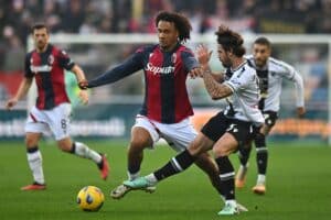 UDINE, ITALY - DECEMBER 30: Joshua Zirkzee of Bologna FC competes for the ball with João Ferreira of Udinese Calcio during the Serie A TIM match between Udinese Calcio and Bologna FC at Dacia Arena on December 30, 2023 in Udine, Italy. (Photo by Alessandro Sabattini/Getty Images)